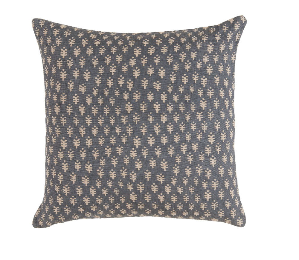 Decorative pillow with a subtle pattern on a plain background