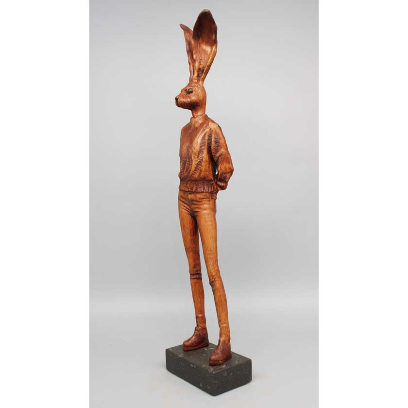 Joe Lupiani's Wooden sculpture of rabbit ears on a gray background