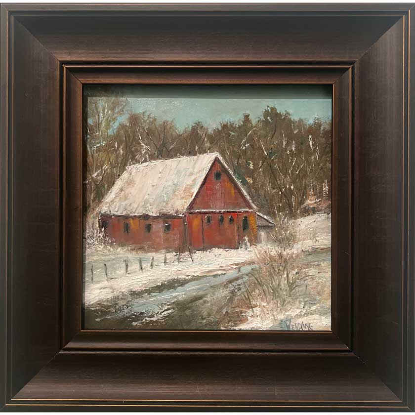 Framed painting of a red barn in a snowy landscape