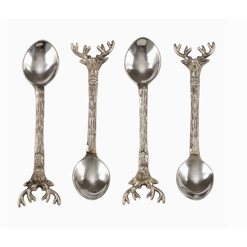 Four silver spoons with unique handles on a white background