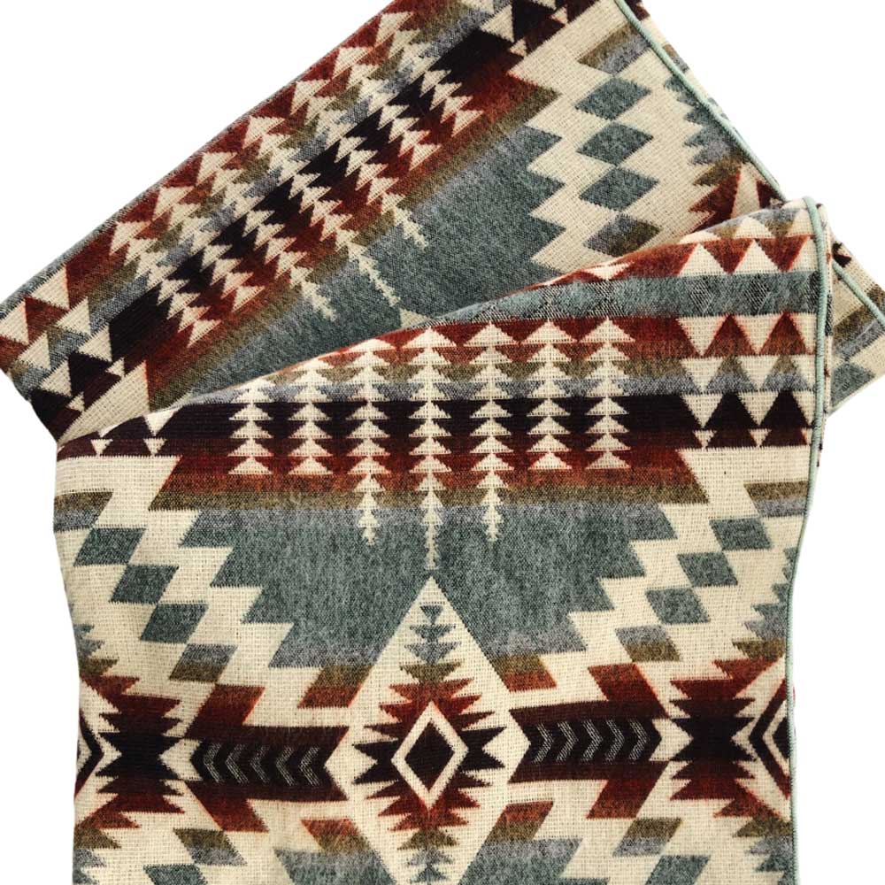 Stack of fabric with geometric pattern on a white background