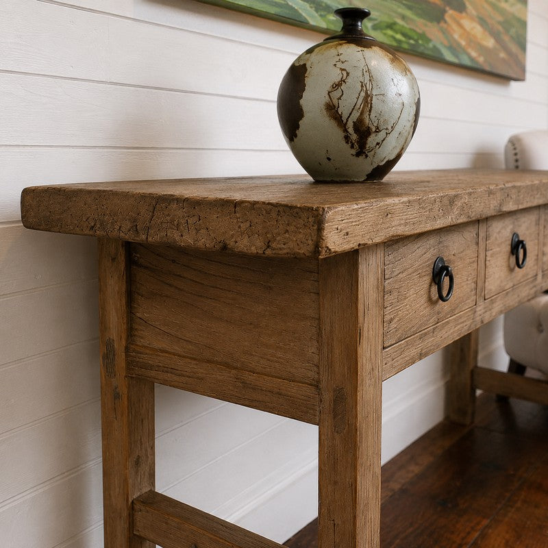 Handcrafted reclaimed wood console table with four drawers and iron ring pulls. A one-of-a-kind entryway, hallway, or sofa table rich in character and storage.