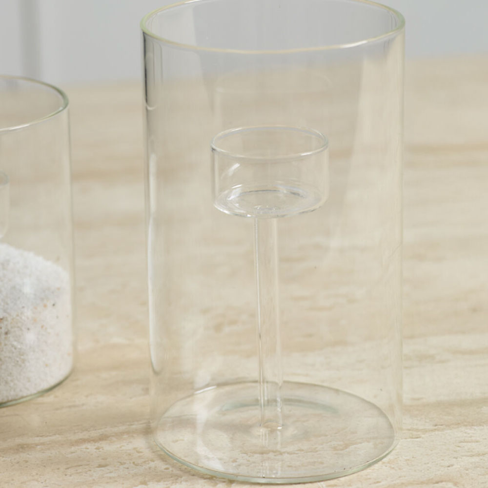 Clear glass candle holder on a wooden surface