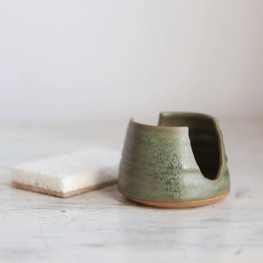 Gravesco Pottery moss green stoneware sponge holder shown empty, side angle showing drainage notch