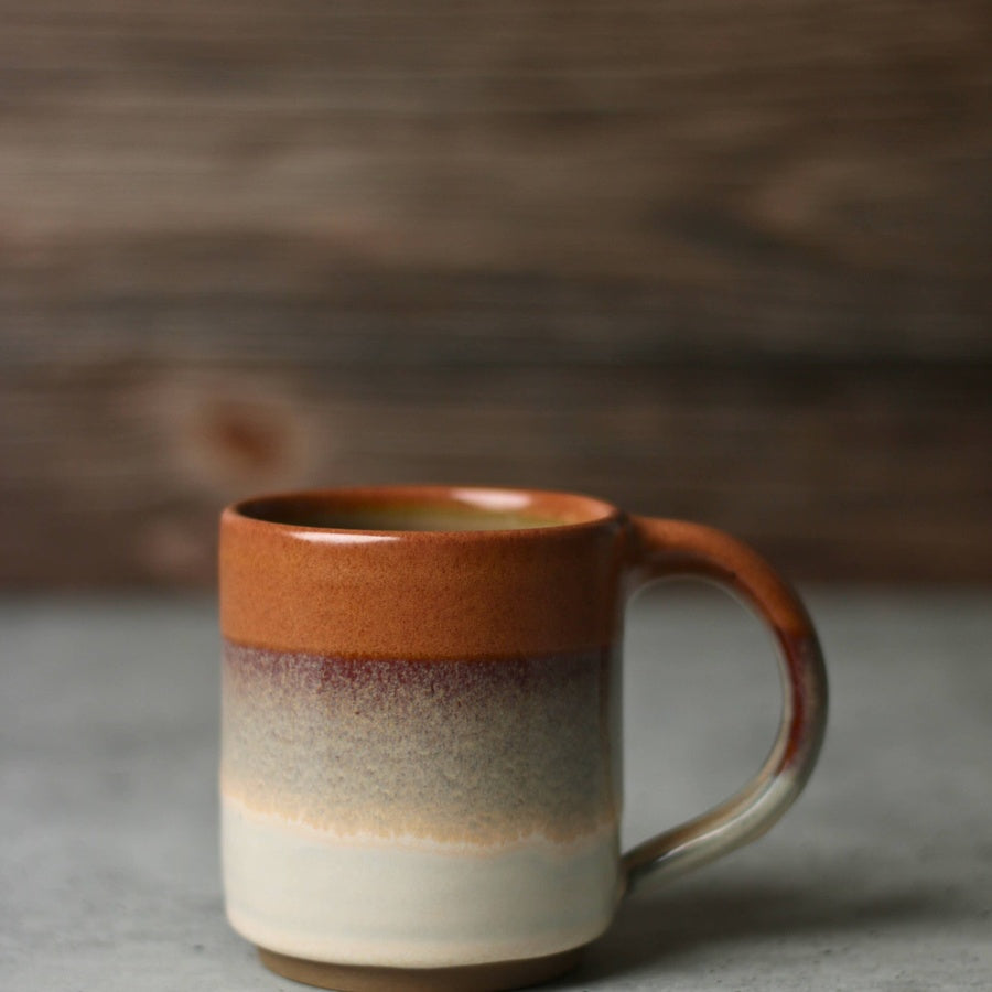 Jordan-Jean Ceramics Sienna handmade ceramic mug with rust and cream reactive glaze, alternate angle