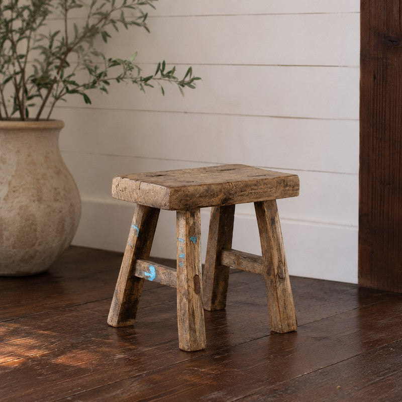 Handcrafted from reclaimed wood, this rustic mini pillow stool is perfect as a decorative display riser for pottery, plants, candles, and collected objects. Approximately 10" x 5" x 9".