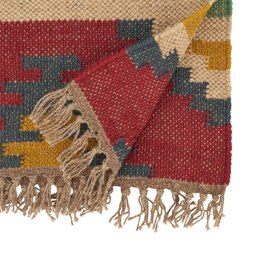 Saro Lifestyle Tribal Tapestry kilim table runner in red teal and gold, folded corner detail