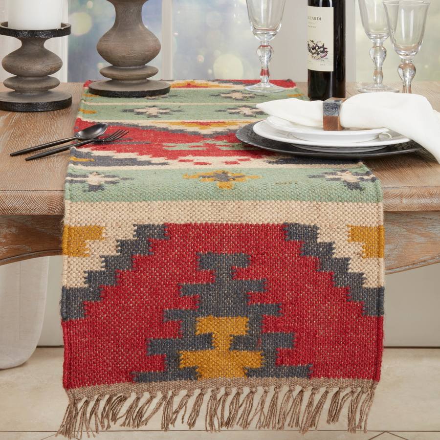 Saro Lifestyle Tribal Tapestry kilim table runner styled on dining table with wine and place setting