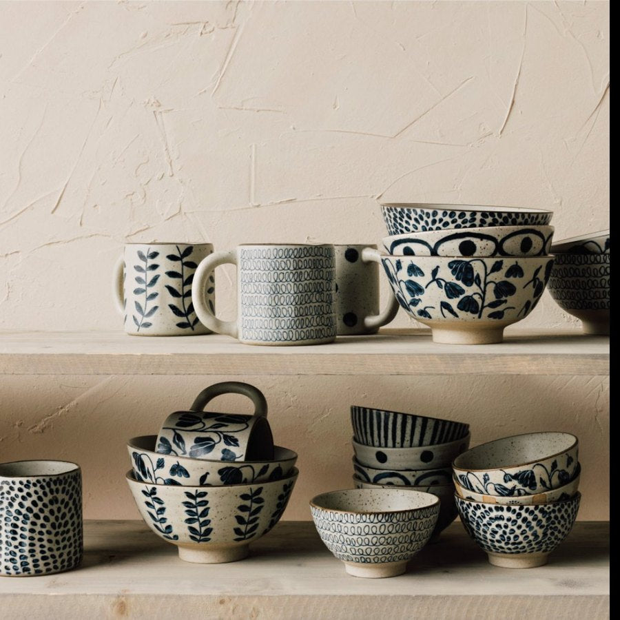 Stoneware element collection mugs and bowls with blue botanical patterns displayed on wood shelves | DaVallia Art & Interiors Chester Vermont