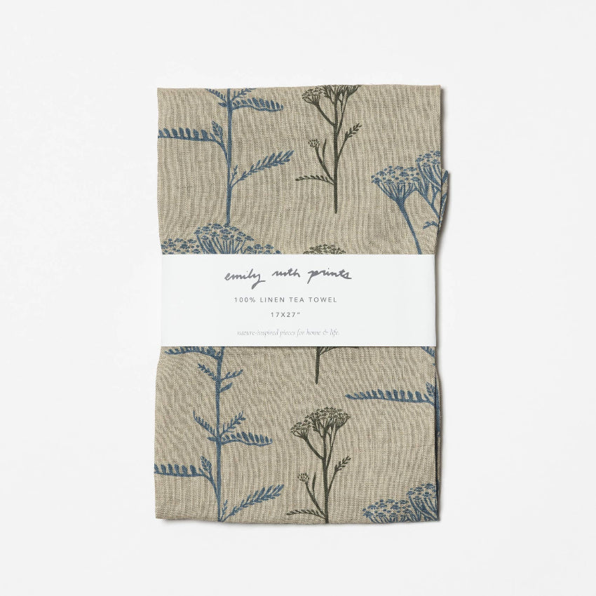 Two linen tea towels with floral pattern on a white background